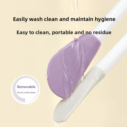 Purple silicone face mask applicator being rinsed